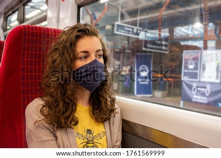 Wear a mask on the train coronavirus uk travel rail railway transport public Royalty-Free Stock Photo #1761569999