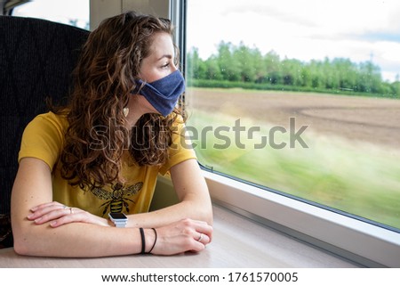Wear a mask on the train coronavirus uk travel rail railway transport public Royalty-Free Stock Photo #1761570005
