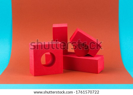 Red geometric shapes on a brown background. Template composition for advertising, products.