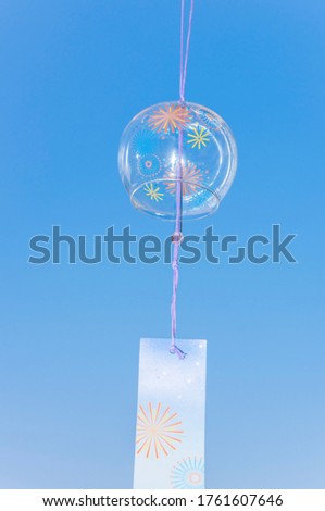 Japanese wind chime against blue sky.
Japanese summer concept.