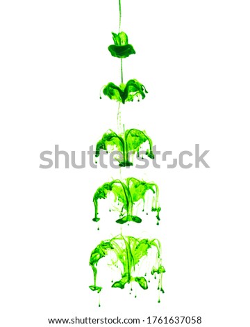 green ink in water on white background