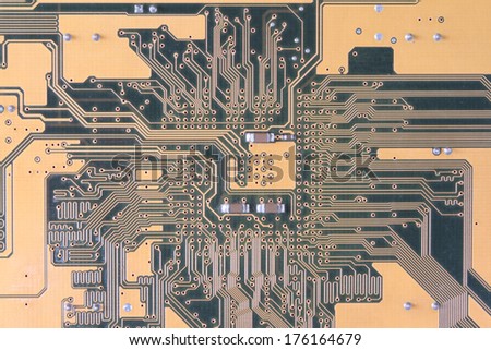 High technology background - yellow printed circuit board.