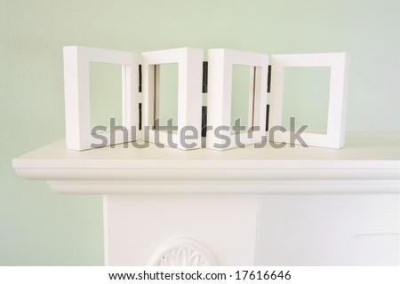 mantel with empty picture frame for your pictures