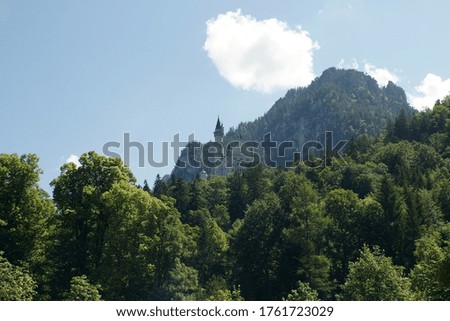 mountain with castle and clouds