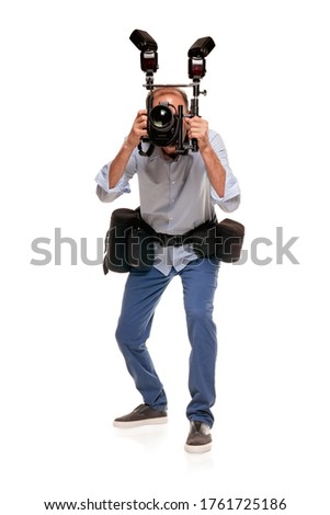 Full portrait of male journalist working with digital professional camera Royalty-Free Stock Photo #1761725186