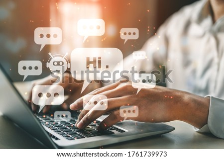 AI Chatbot smart digital customer service application concept. Computer or mobile device application using artificial intelligence chat bot automatic reply online message to help customers instantly. Royalty-Free Stock Photo #1761739973