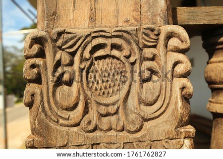 wooden carved handrails in an ancient indian temple