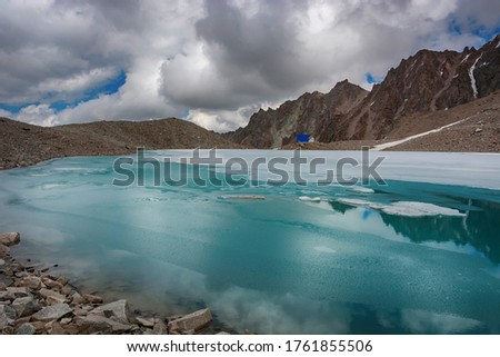 Wonderful mountain landscape with turquoise lake, reflection, peaks). Picturesque view near Adygine lake in Kyrgyz Alatoo mountains, Tian-Shan, Kyrgyzstan.