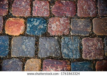 beautiful cobblestone lane with colorful stones
