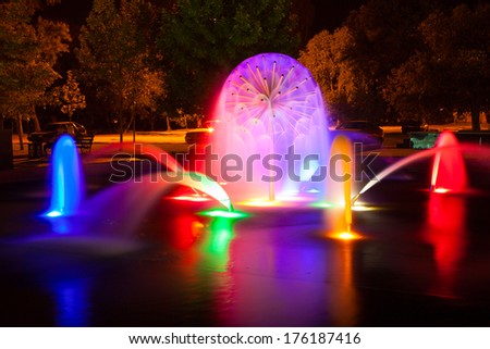 fountain with colorful illuminations at night