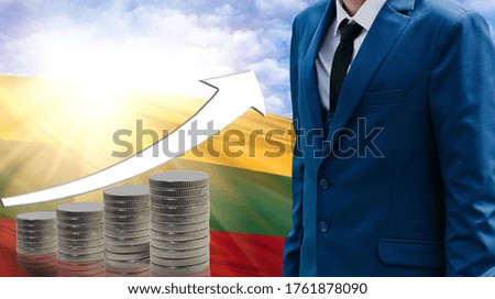 Business concept of increasing sales, Businessman on the background of the flag of Lithuania and a graph of increasing up.