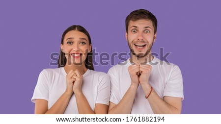 Please. Portrait of young couple expressing emotions, pleading and gesturing hope over pastel purple studio wall, banner