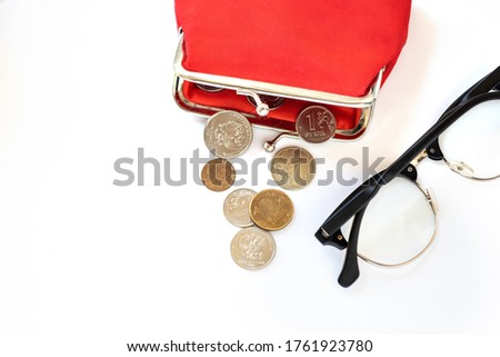 red wallet with Russian coins, rubles and kopecks, the concept of indexing a pension, a living wage, raising the retirement age Royalty-Free Stock Photo #1761923780