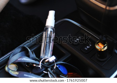 Hand sanitizer placed on car seat and exposed to sun for a long time in sunny very hot day.Do not keep alcohol antiseptic gel in the car,dangerous flammable objects can cause a fire inside the car. Royalty-Free Stock Photo #1761925007