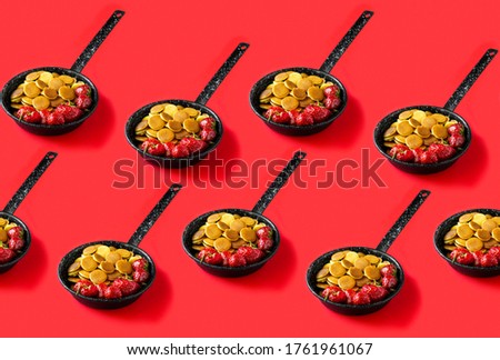 Trendy food - pancake cereal. Seamless pattern of Mini cereal pancakes with strawberries in pan on red background