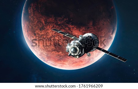 Spaceship on orbit of red planet Mars. Expedition and colonization of other worlds. Outer space and stars on background. Elements of this image furnished by NASA. Royalty-Free Stock Photo #1761966209