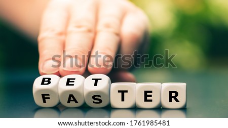 Symbol for better work instead of faster work. Hand turns dice and changes the word "faster" to "better". Royalty-Free Stock Photo #1761985481