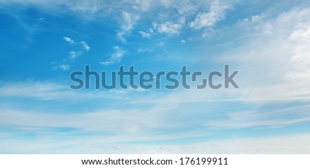 Beautiful fluffy clouds on blue sky                                    