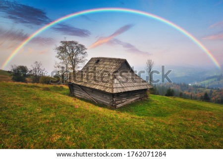 Rainbow over the Mountains. autumn morning in the Carpathians