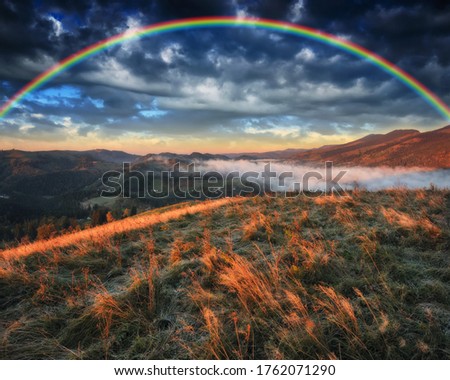 Rainbow over the Mountains. autumn morning in the Carpathians