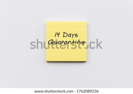 14 days quarantine text on sticky paper post note