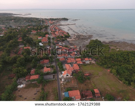the aerial view of nuance of the village on the beach which is rather dense, one of the largest salt producers in the province of East Java