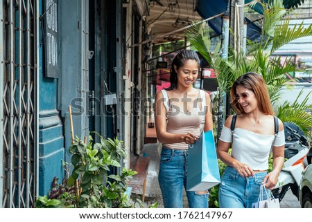 Two girls with shopping bag stock photo