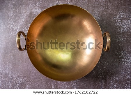 brass wok, Thai traditional cookware, used for cooking desserts or fruit preserves  Royalty-Free Stock Photo #1762182722