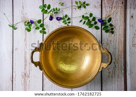 brass wok, Thai traditional cookware, used for cooking desserts or fruit preserves  Royalty-Free Stock Photo #1762182725