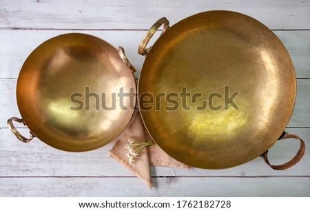 brass woks, Thai traditional cookware, used for cooking desserts or fruit preserves  Royalty-Free Stock Photo #1762182728