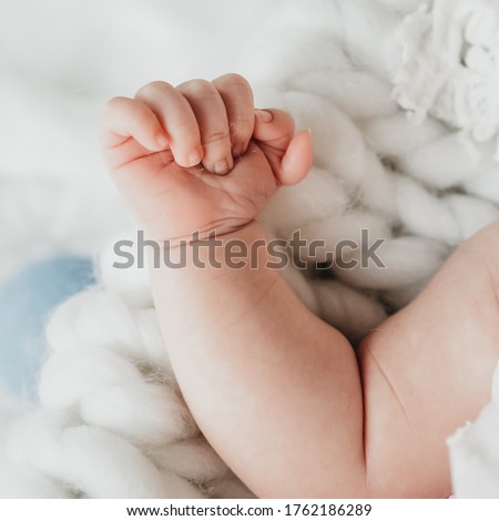 Malaga Andalusia Spain 15 April 2019 Polydactyly which is a congenital limb malformation on a newborn baby with six fingers on one hand Royalty-Free Stock Photo #1762186289