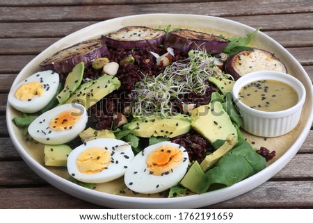 paleo diet with boiled eggs avocados and eggplant