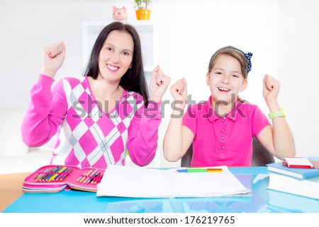 Mother helps daughter of homework and having fun