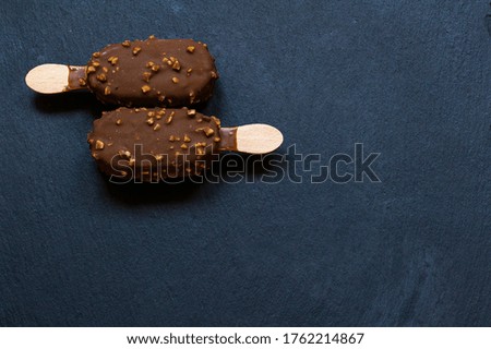 Chocolate and almond ice cream on black background