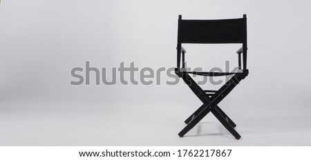 Back of black director chair use in video production or movie and cinema industry on white background. Royalty-Free Stock Photo #1762217867