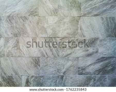 Brick wall made from marble is texture and background. Natural marble stone brick or block wall. Pattern for designers.