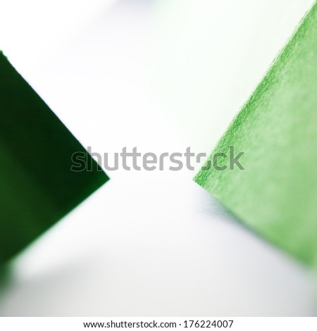 Macro, abstract, background picture of a green paper on paper background 