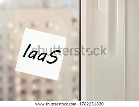 white paper with text "laas" on the window