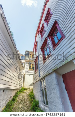 Bergen, Norway, old wooden houses with narrow street in between.