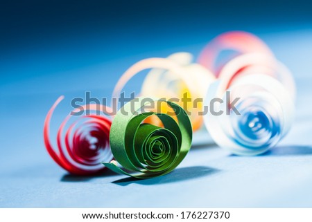 Macro, abstract, background picture of colored paper spirals on paper background 