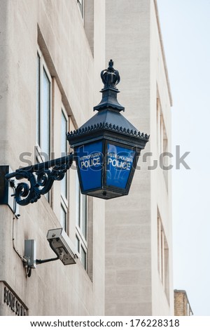 Close-up of a traditional police lantern, on display outside a metropolitan police station in the center of London, England.