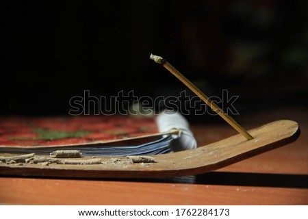 Incense sticks burning iindian agarbatti smoke aroma incense stand burning incense sticks smoke dynamic beautiful calm relax concept Incense on a wooden table