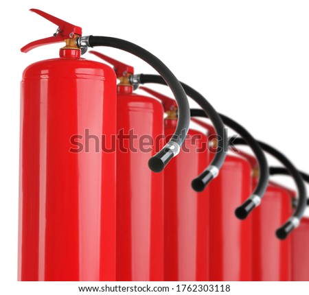 Set with fire extinguishers on white background 
