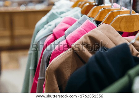 fashion clothing on hangers at the show