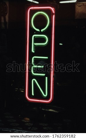 Illuminated Neon Open Sign at night