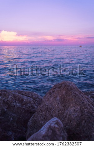 Sunset in Lake Ontario on a calm day of Summer