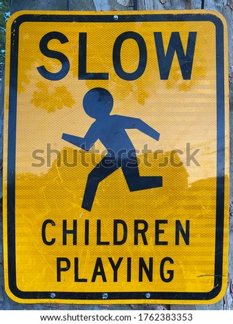 Yellow Slow children playing traffic warning sign in Mount Vernon New York