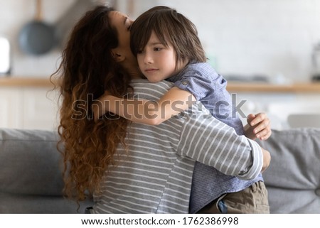 Close up caring young mother hugging preschool upset son. Lovely mom embracing and supporting child in difficult times. Stressful kid asking help from mum. Royalty-Free Stock Photo #1762386998