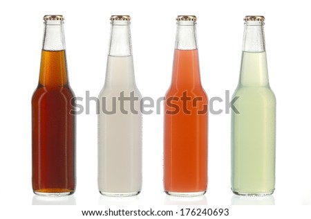 Four assorted soda bottles, non-alcoholic drinks with water drops Royalty-Free Stock Photo #176240693