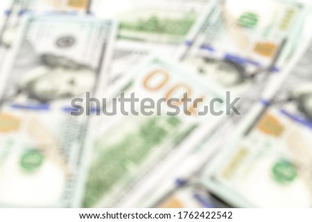 Dollar sign abstract blur background. American money. 100 hundred paper cash in soft focus, usd bill. Usa currency blurred.